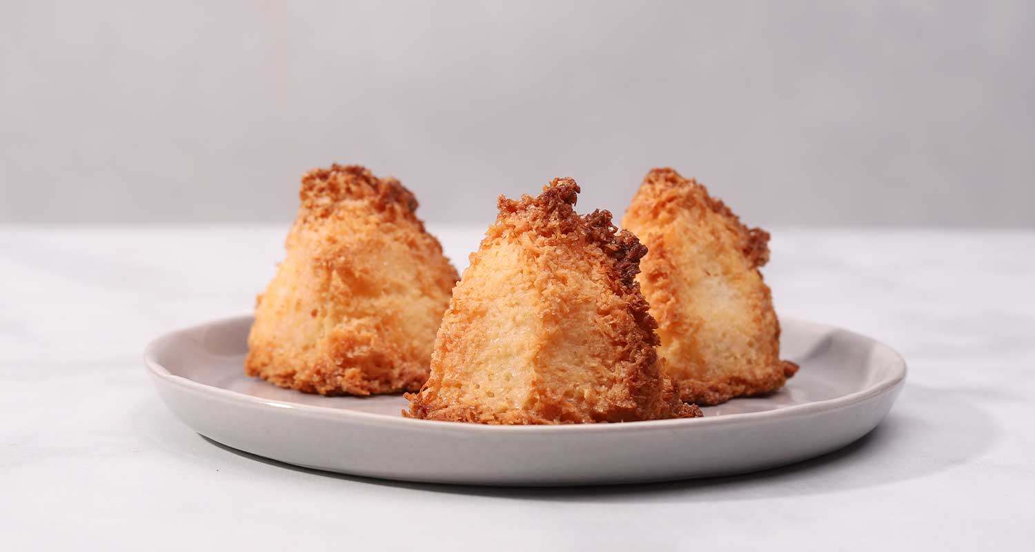 Coconut macaroons on plate side view