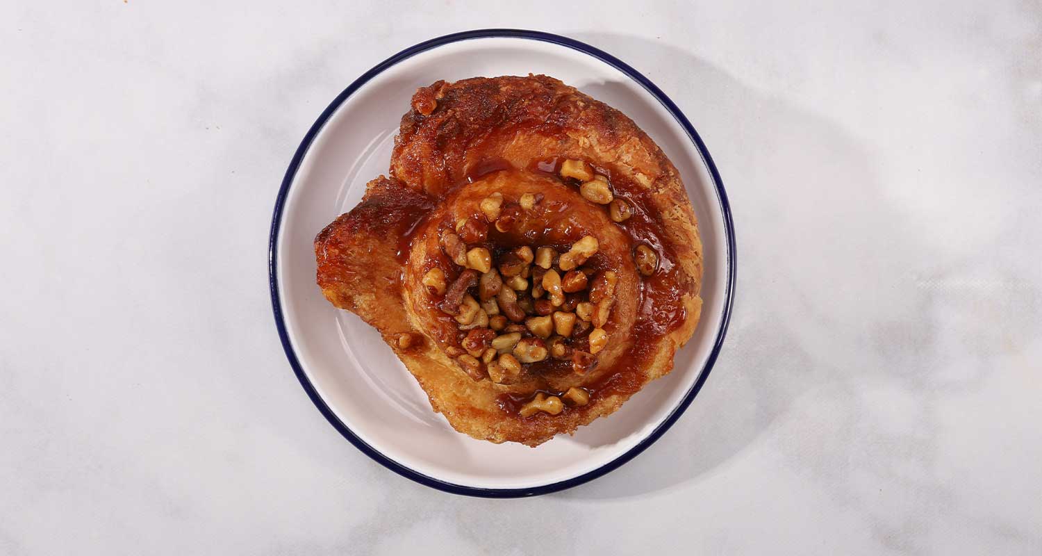 Top view of morning bun with walnuts